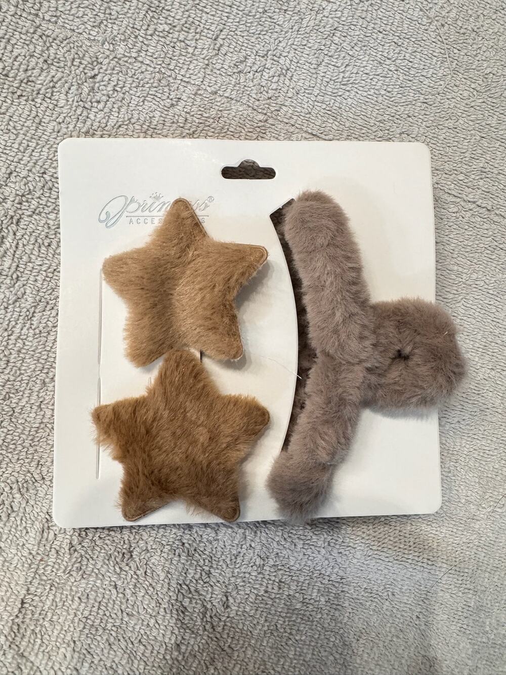 Brown faux fur hair clips set with star shapes and hair claw